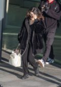 Selena Gomez spotted in a fur jacket as she touches down at Heathrow Airport in London, UK