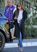 Dakota Johnson tips the valet after a lunch meeting at the San Vicente Bungalows in West Hollywood, California