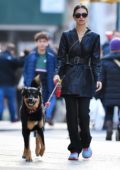 Emily Ratajkowski looks chic in a black leather coat while out walking her dog in New York City