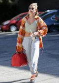 Hailey Bieber flaunts her flat abs as she hits up the dance studio in West Hollywood, California