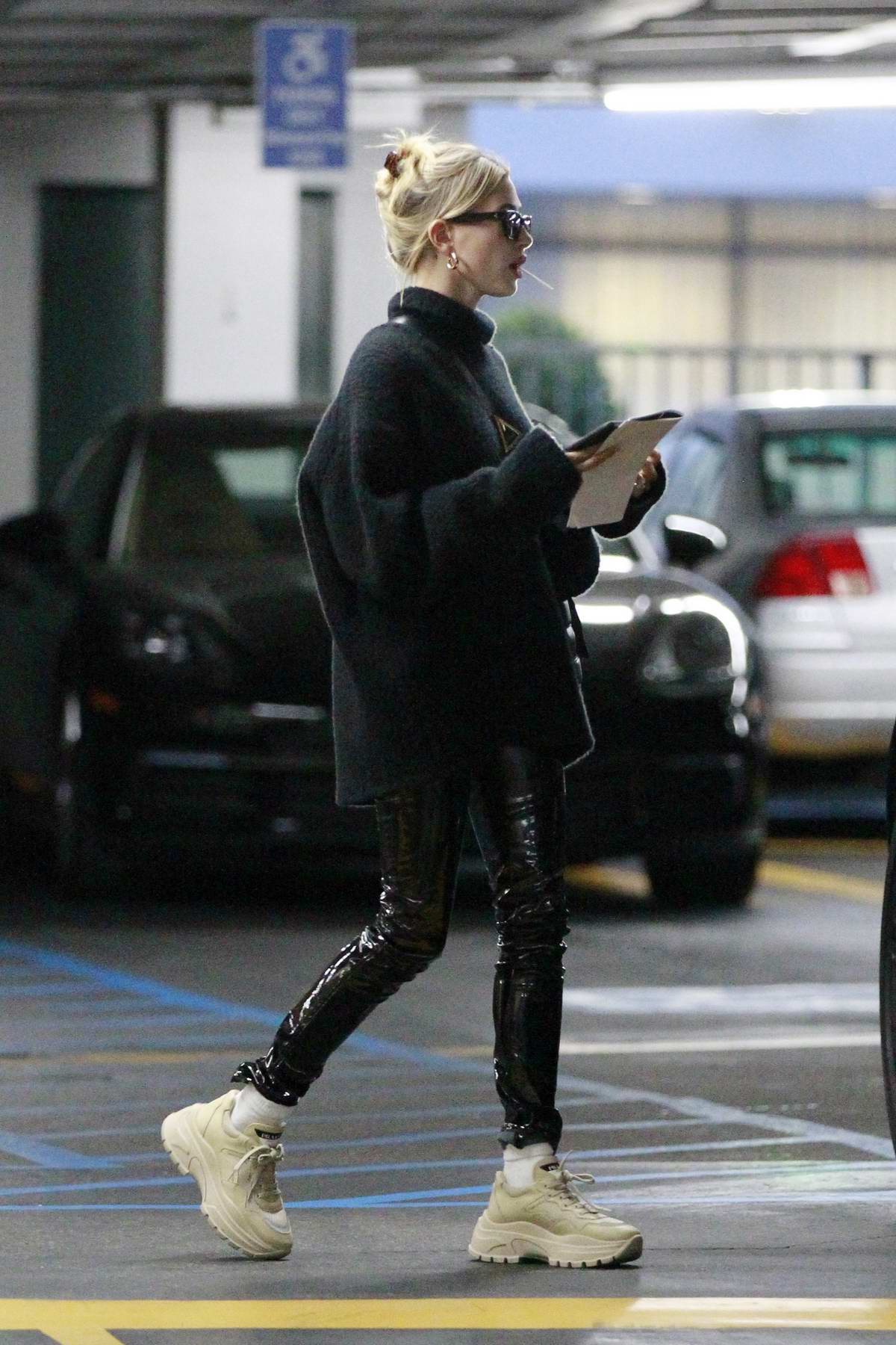 hailey bieber wearing black pvc pants and balenciaga sneakers while out with a friend los angeles-200120_6