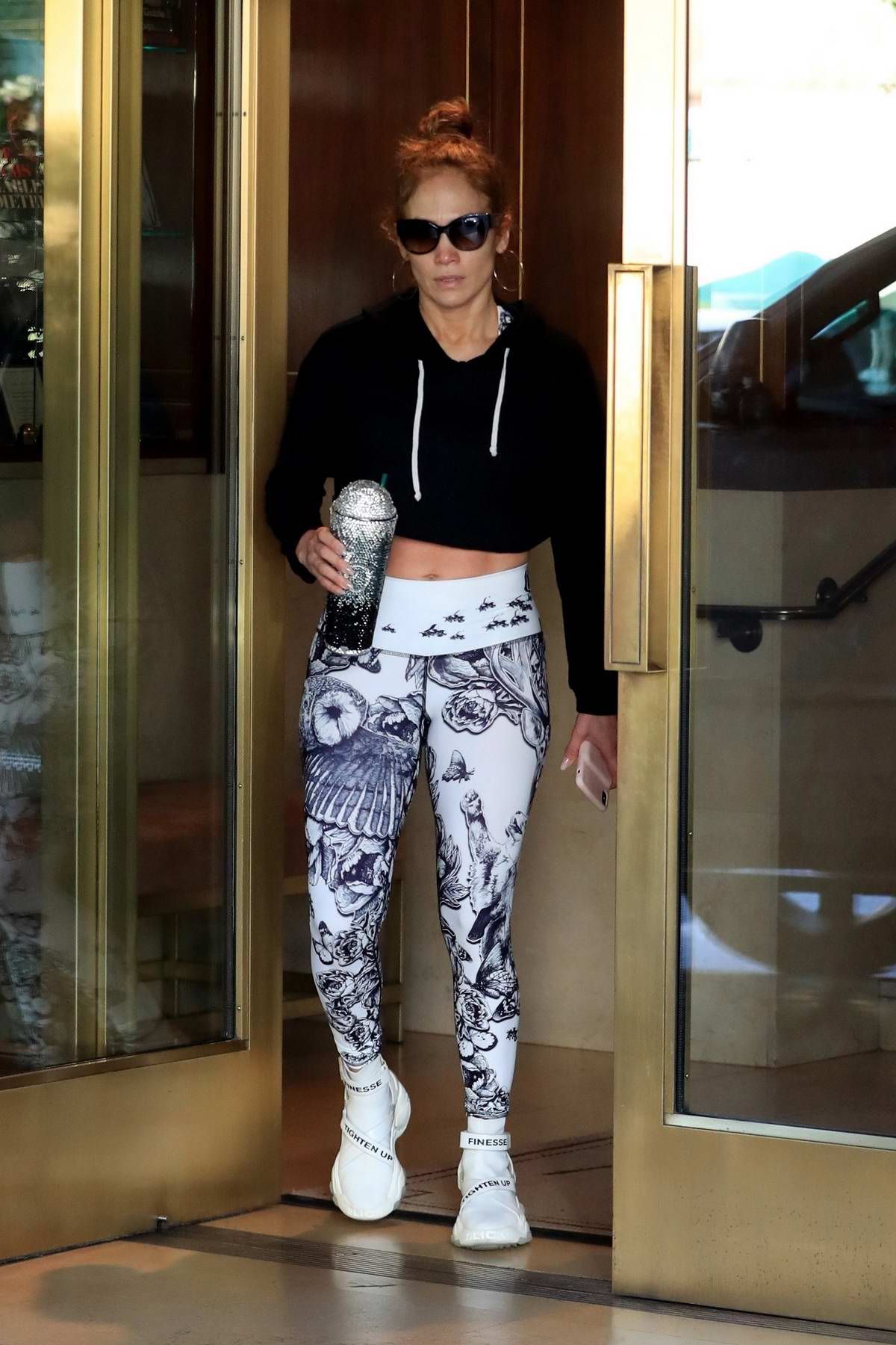 jennifer lopez sports cropped hoodie and leggings as she leaves the gym ...