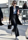 Kaia Gerber looks chic in a black suit as she arrives at the Chanel fashion show in Paris, France