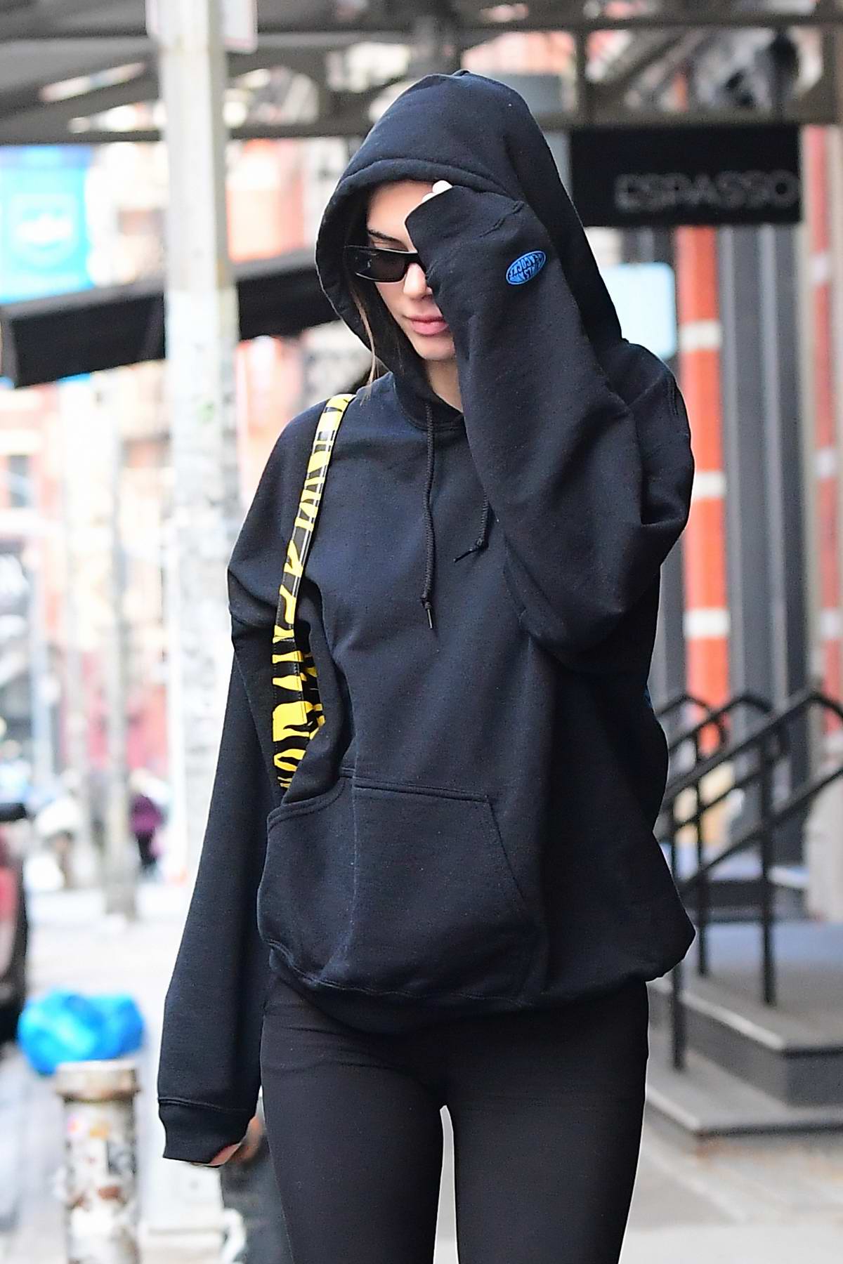 Kendall Jenner shows off her slender figure in a black hoodie and