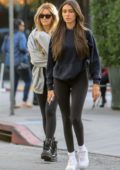 Madison Beer sports a light blue sweatshirt and black leggings while  visiting a salon in West