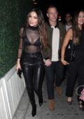 Olivia Culpo rocks a sheer top as she and boyfriend Christian McCaffrey head to the Delilah in West Hollywood, California