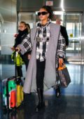 Rihanna makes a stylish arrival at JFK Airport in New York City