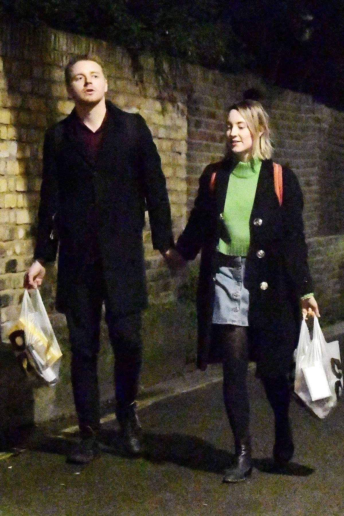 saoirse ronan steps out for an evening stroll while holding hands with  scottish actor jack lowden in london, uk-080120_7