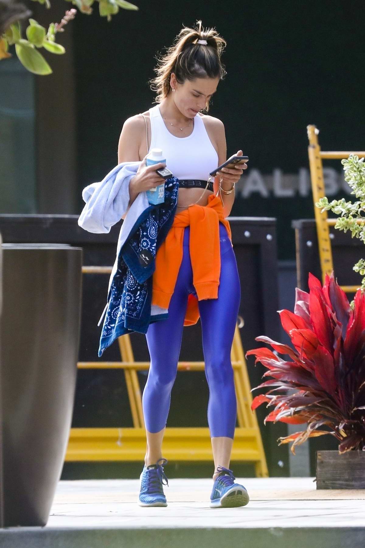 Alessandra Ambrosio looks incredible in bright blue leggings and