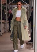 Bella Hadid shows off her toned abs in a white crop top as she heads into the Marc Jacobs show in New York City