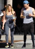 Hilary Duff looks fit in a white tank top and dark brown leggings while out  heading for her workout in Los Angeles-170623_5