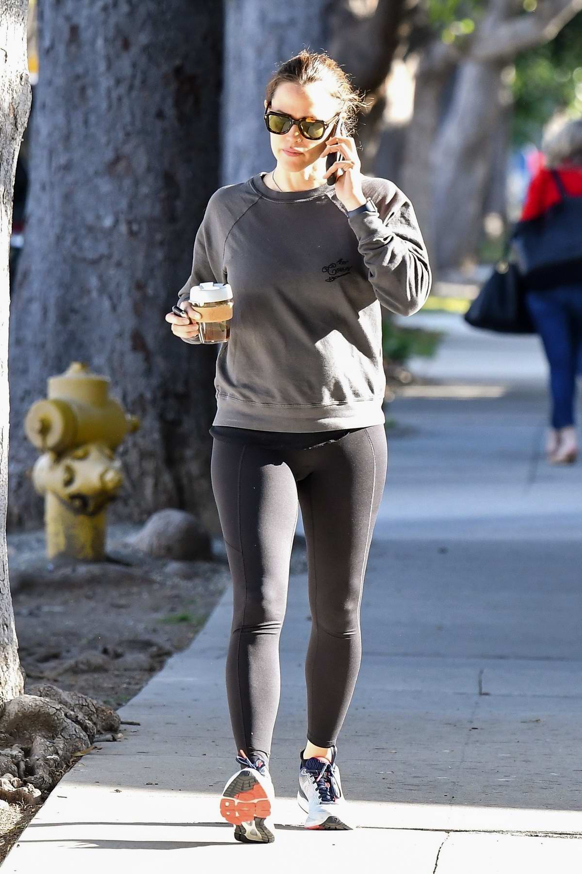 Lucy Hale dons tie-dye leggings and a fleece while heading for her morning  workout in