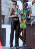 Kendall Jenner flaunts her toned abs in crop top and sheer pants while out for lunch at a local eatery in Miami, Florida