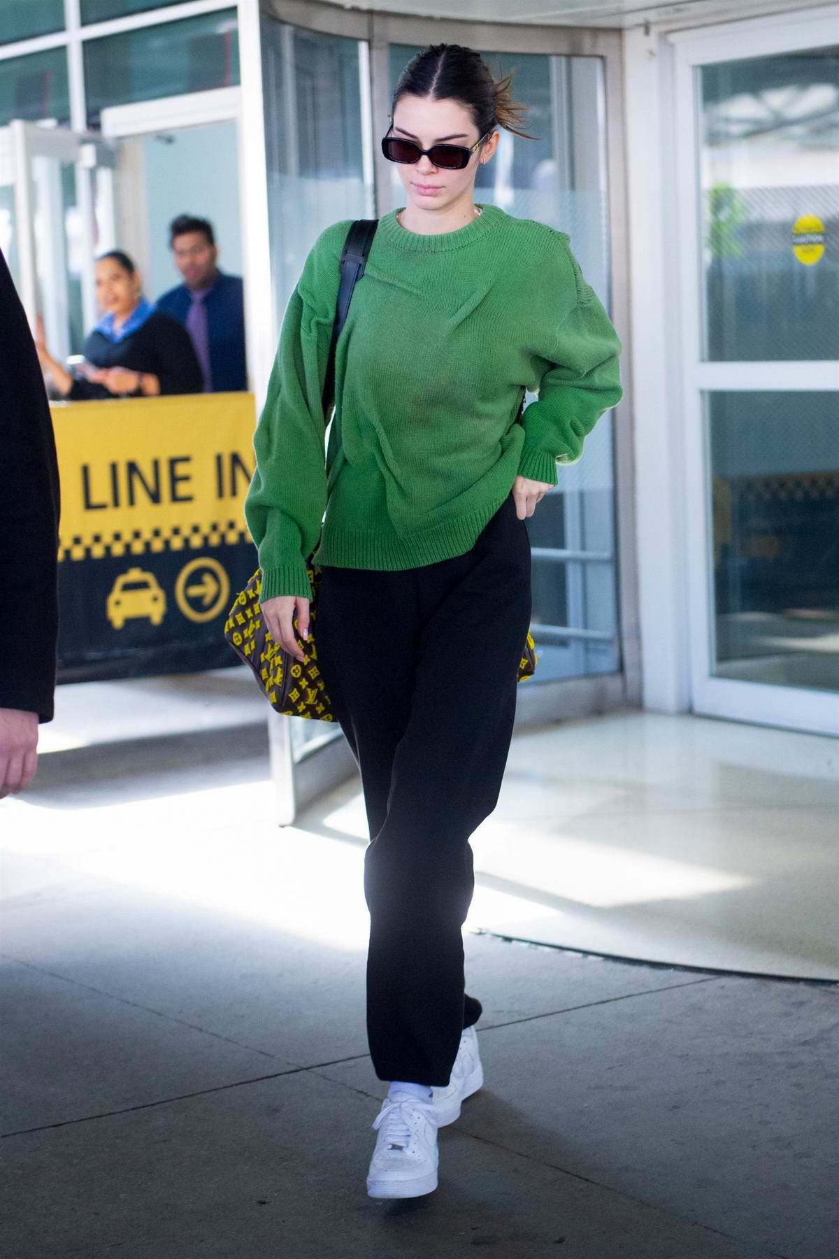 Kendall Jenner's Sweater Top, Pants: Airport Style Photo