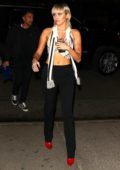 Miley Cyrus flashes her midriff as she leaves Marc Jacobs show and heads to The Bowery Hotel in New York City