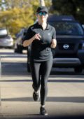 Reese Witherspoon looks toned in black leggings as she goes