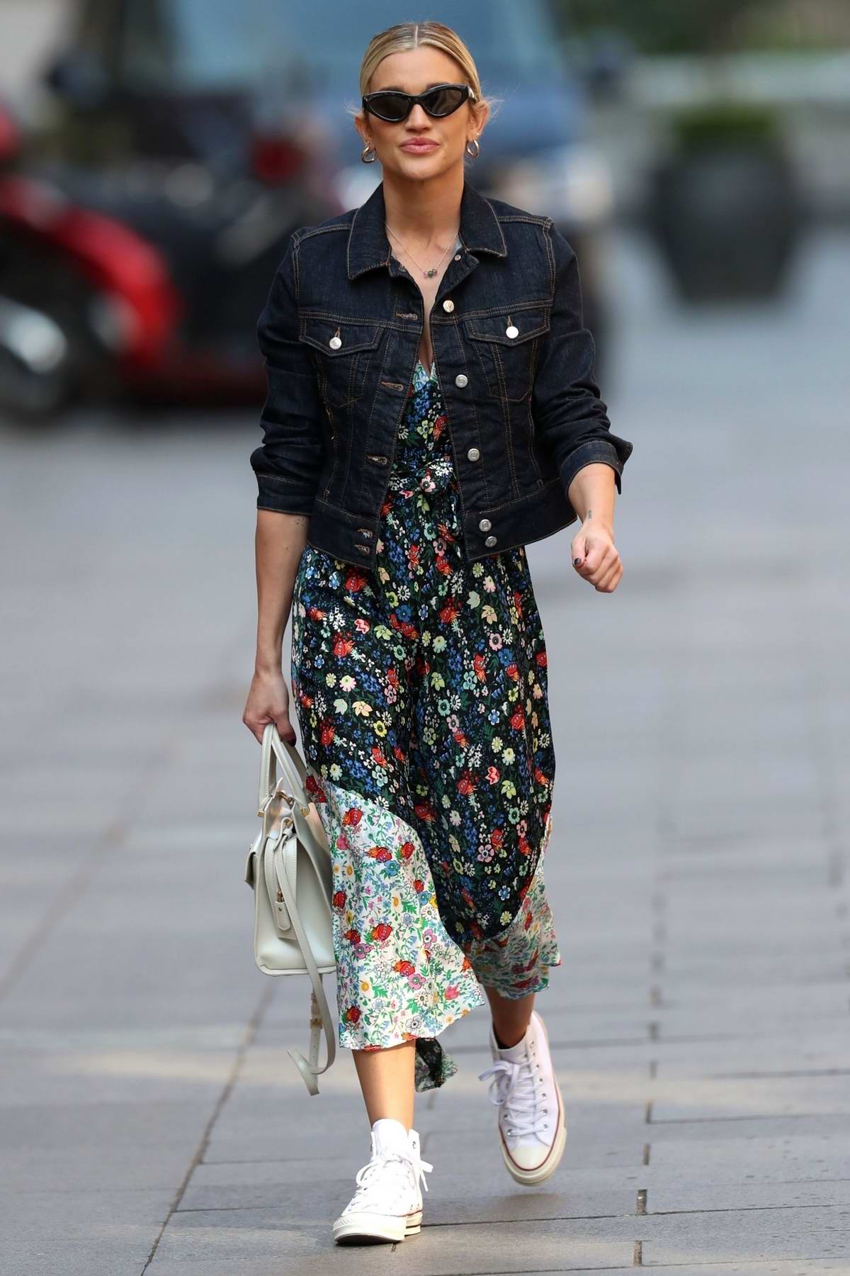 Ashley Roberts looks lovely in a summer dress and a denim jacket as she