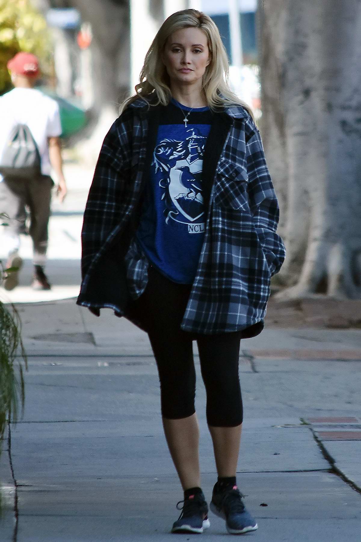 Holly Madison wears a checkered flannel shirt and leggings while out for a  walk in Studio
