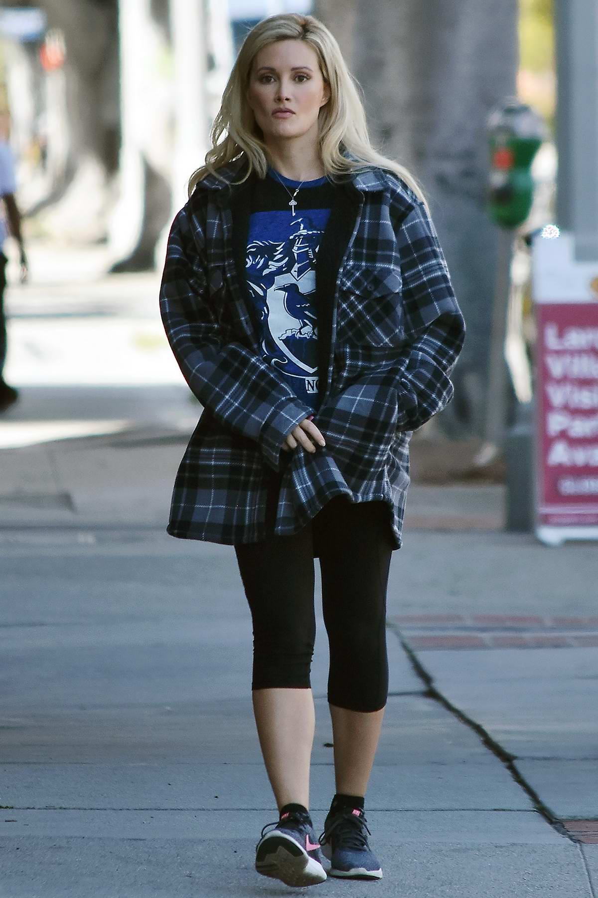 Holly Madison wears a checkered flannel shirt and leggings while out for a  walk in Studio
