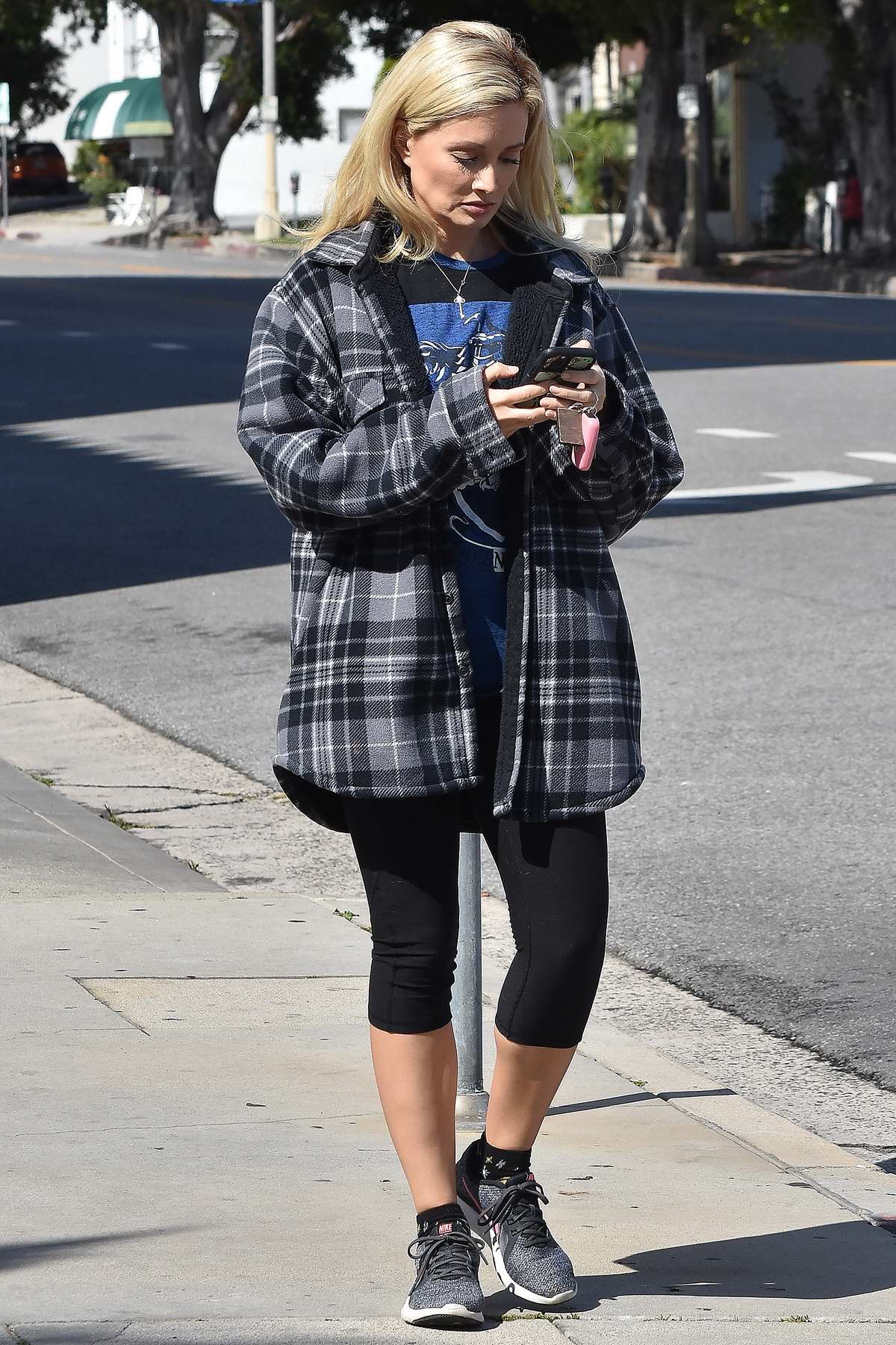holly madison wears a checkered flannel shirt and leggings while out for a  walk in studio city, california-230320_7