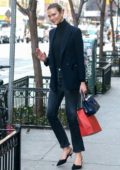 Karlie Kloss puts on a stylish display in a dark blue blazer and jeans while out in New York City