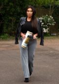 Lauren Goodger picks up a roll of toilet paper on her way home in London, UK