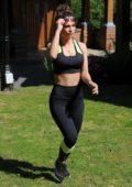 Rebecca Gormley flaunts her fit body in a crop top and leggings during a solo  workout