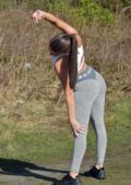 Rebecca Gormley flaunts her fit body in a crop top and leggings during a solo  workout