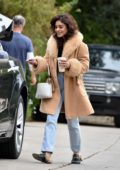 Vanessa Hudgens is all smiles and covered in a faux fur coat as she wraps up a photo shoot in Los Feliz, California