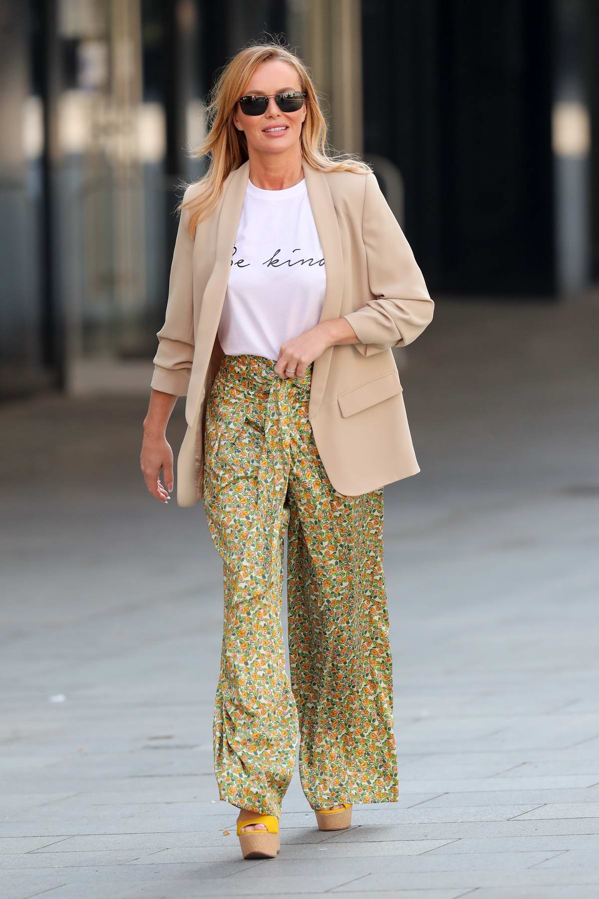 Amanda Holden wears Zara print trousers and SilkFred slogan top as she  exits Heart Radio in