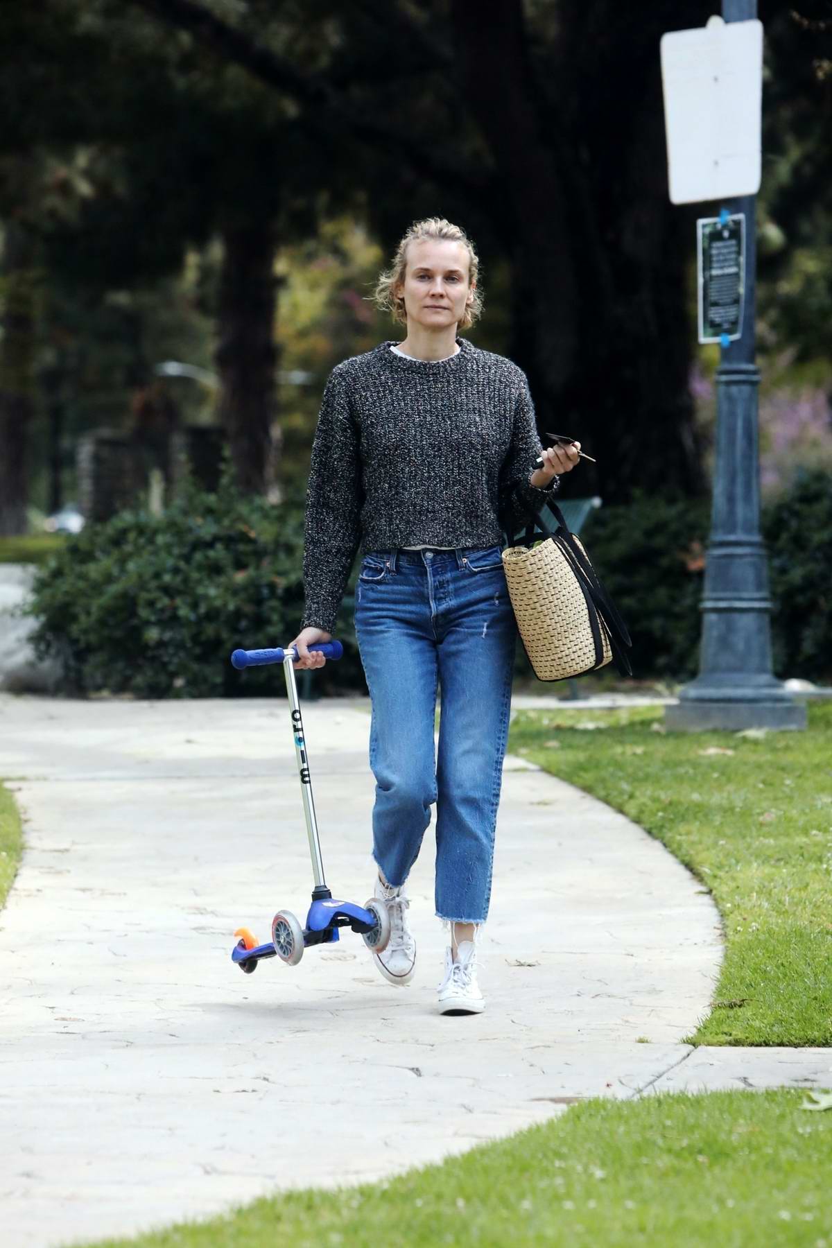Diane Kruger wipes down park bench for baby daughter amid coronavirus