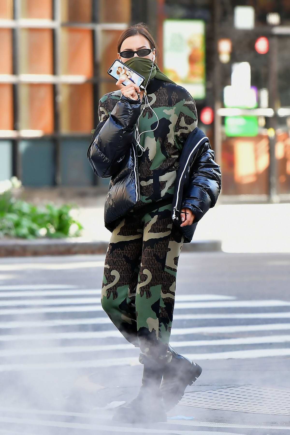 irina shayk looks stylish in moschino camouflage jumpsuit and burberry ...
