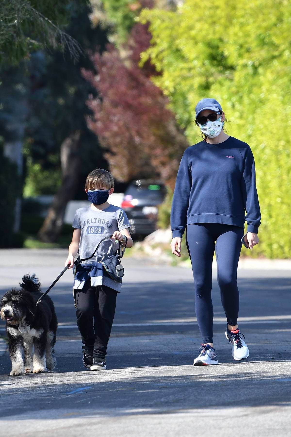 Jennifer Garner takes the dog for a walk with her son in Brentwood ...