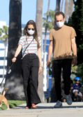 Lily Collins and Charlie McDowell take their dog out for a walk in Beverly Hills, California