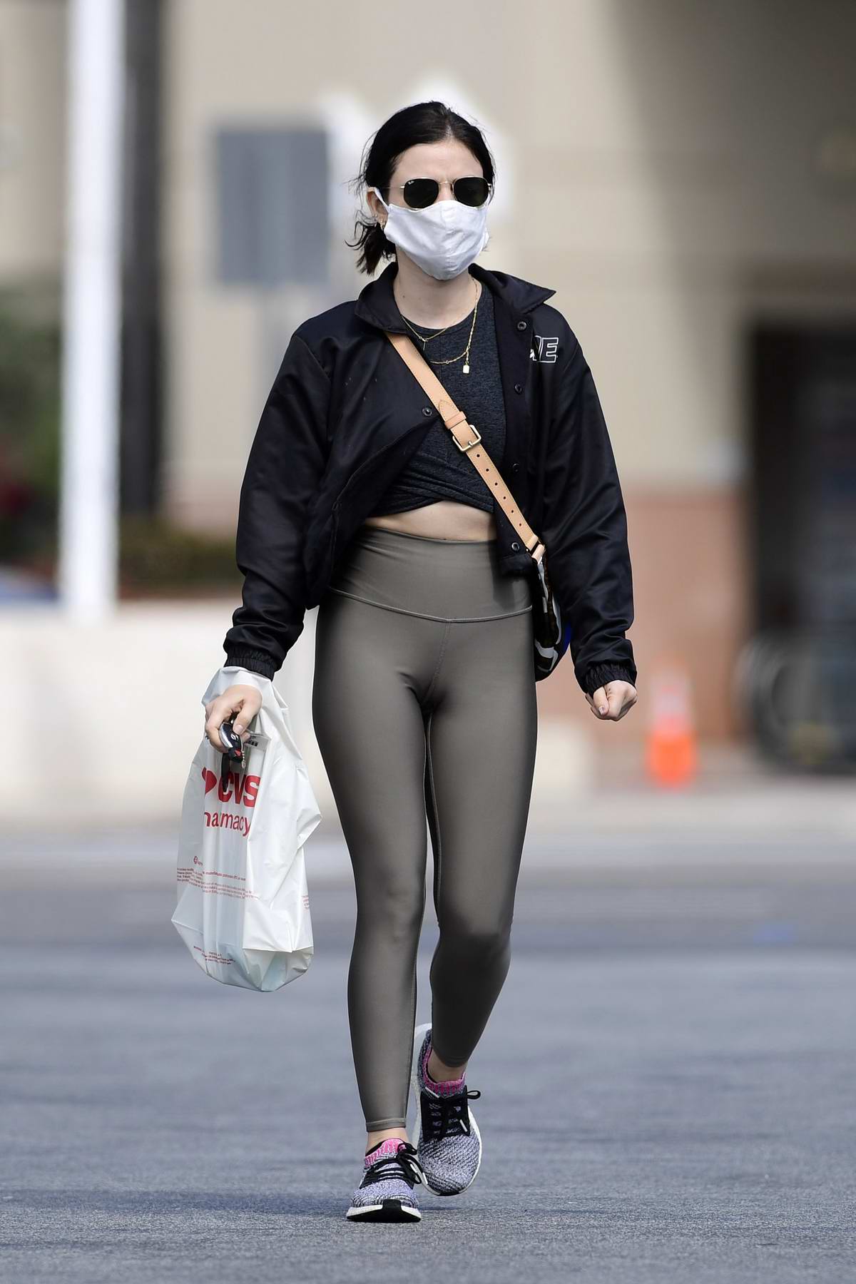 https://www.celebsfirst.com/wp-content/uploads/2020/04/lucy-hale-wears-her-mask-as-she-stops-by-a-cvs-in-los-angeles-040420_13.jpg