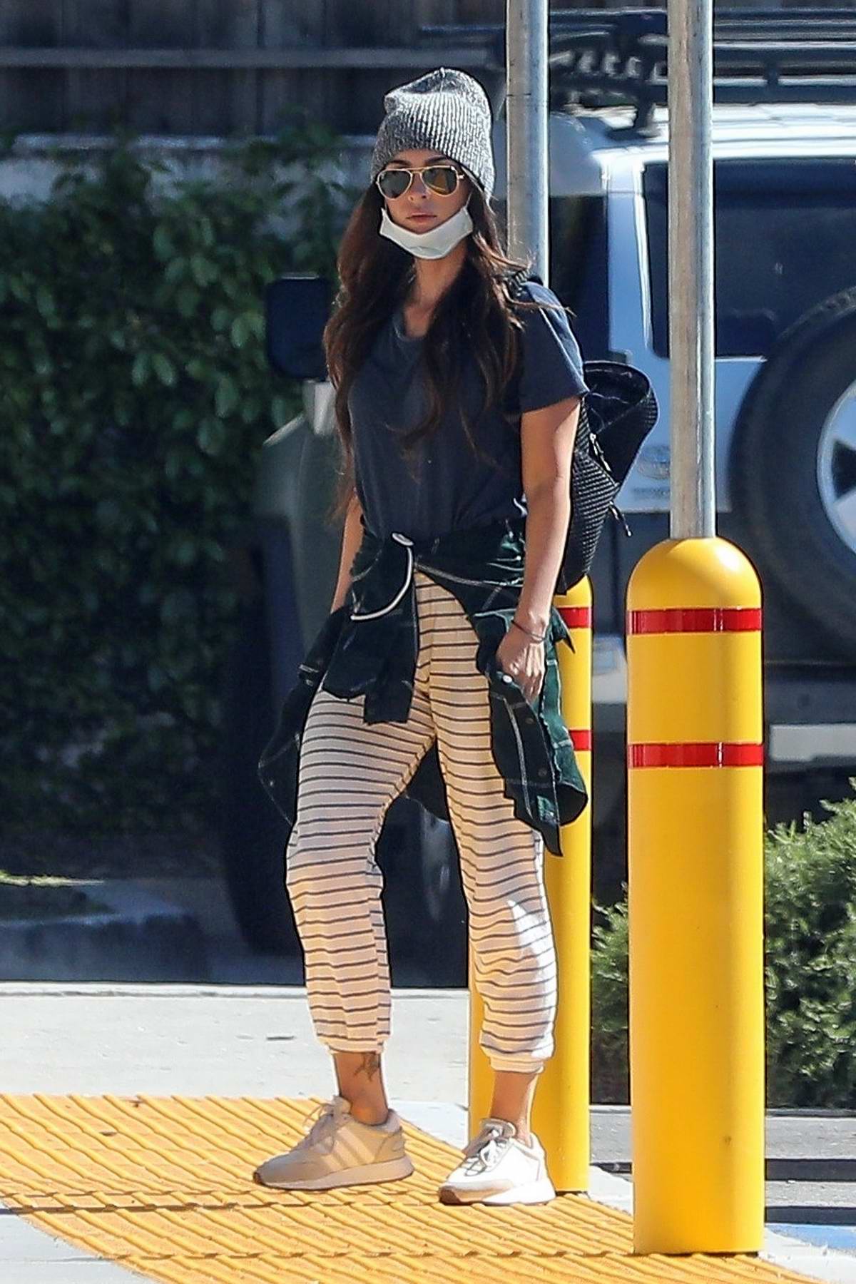Megan Fox looks cool in striped pants during a trip to the local CVS ...