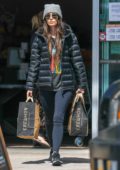 Megan Fox rocks aviator sunglasses with a beanie, puffy jacket and leggings during a grocery run at Erewhon in Los Angeles