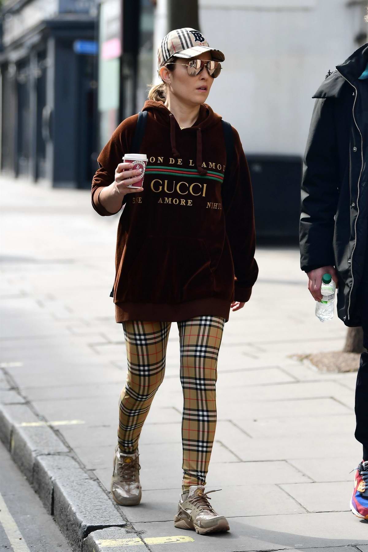 Noomi Rapace sports Gucci hoodie and Burberry check leggings while out  shopping at Planet Organic in