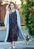 Rachael Taylor steps out for a walk with her dog in Los Angeles