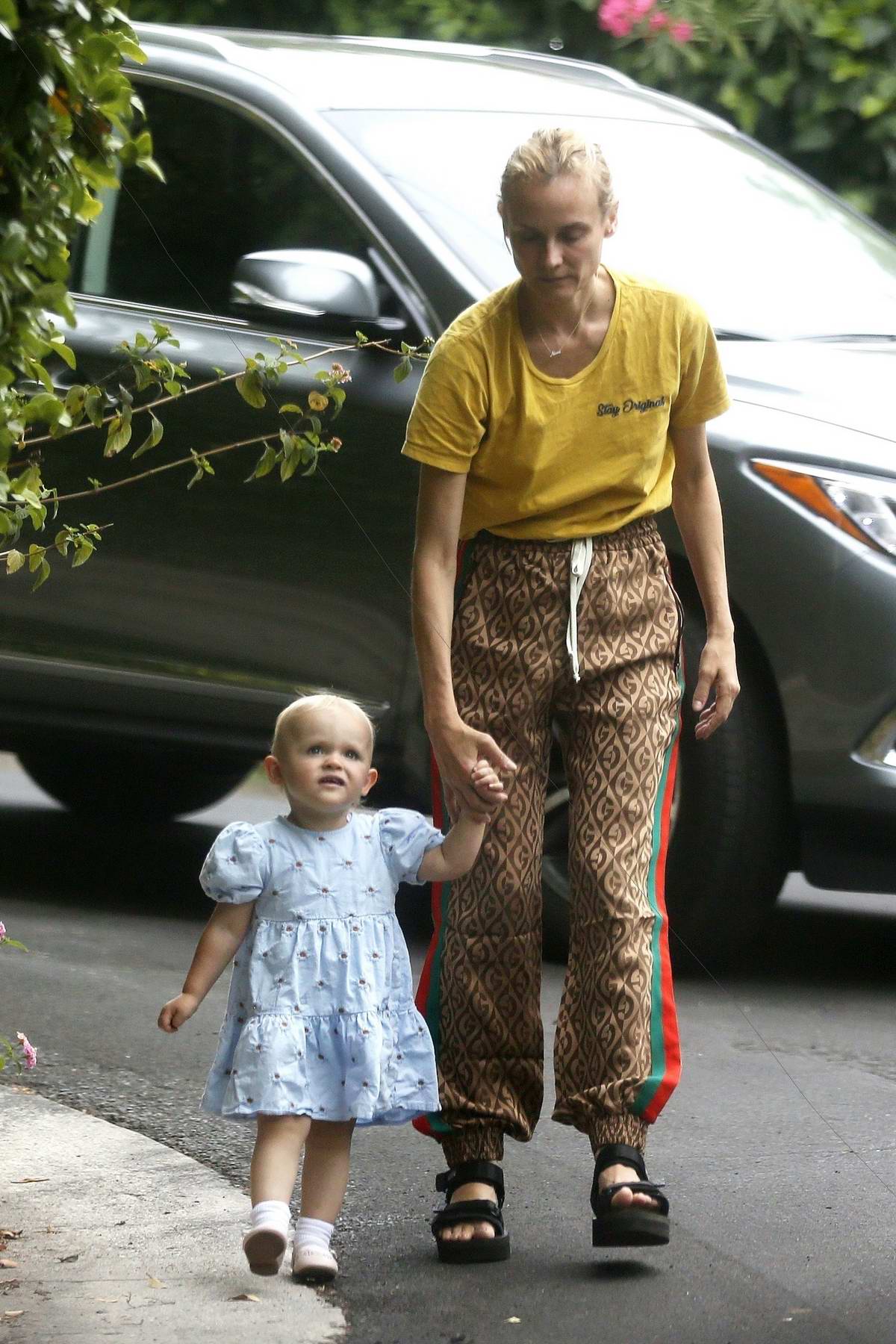 Diane Kruger takes her daughter out for some fresh air around the  neighborhood in Los Angeles