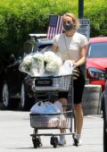 Diane Kruger wears a protective mask as she picks up some flowers and groceries at Bristol Farms in Los Angeles