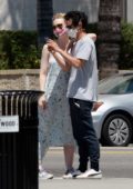 Elle Fanning and Max Minghella gets all loved-up while taking selfies during their stroll in Los Angeles
