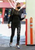 Camila Mendes wears a cream sweater, cropped jeans and ankle boots while  out for stroll in