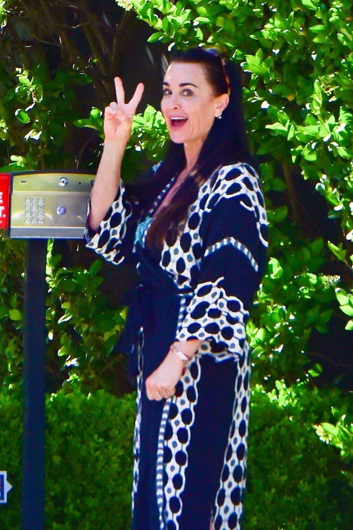 kyle richards stepped out of her house in a chic robe to greet her friend  sutton stracke in beverly hills, california-050520_8