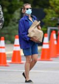 Scarlett Johansson sports a denim romper with matching jacket during a grocery run in East Hampton, New York