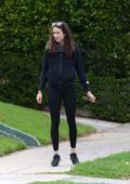 Troian Bellisario steps out for a walk with her daughter and their dog in Los Angeles