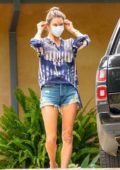 Alessandra Ambrosio puts on her face mask while visiting a friend's house in Malibu, California