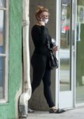 Ariel Winter sports all-black while visiting a skin care clinic with a friend in West Hollywood, California