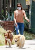 Aubrey Plaza wears a mask as she takes her dogs for a walk in Los Feliz, California