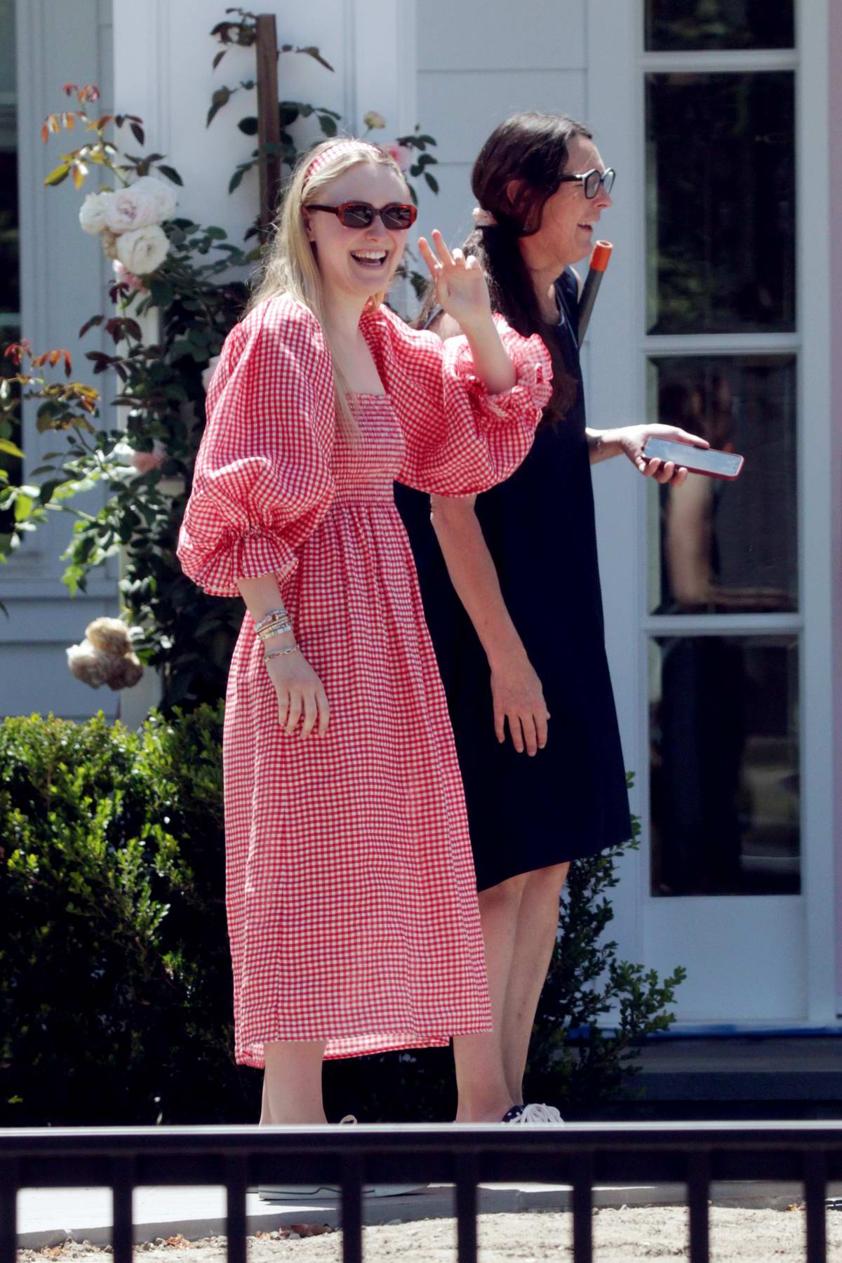 dakota fanning spotted in a red gingham dress while she gets some